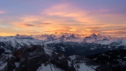 snowy mountains at sunset